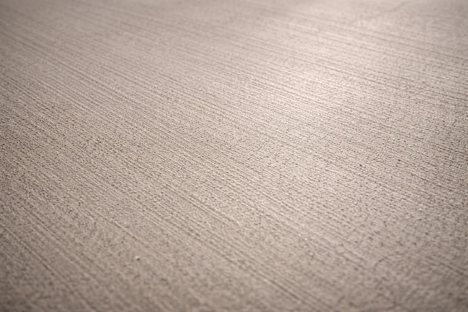 Subtle concrete texture with broom lines.